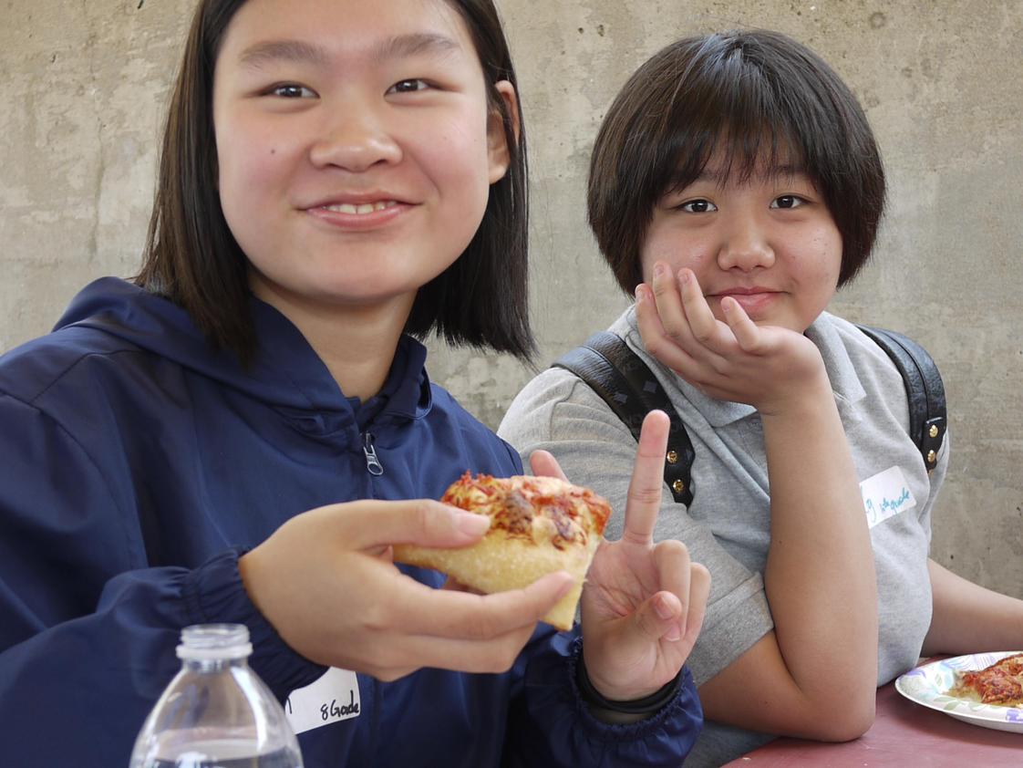 North Hills Christian School Photo - Our international students enjoying a "peace" of pizza at our Middle and High School New Student Orientation.