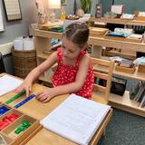 South Coast Montessori School Photo #3 - Spending time on math during her work period.