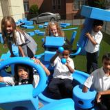 mSt. Brigid School Photo - Ist grade students enjoying the play system in our school yard.