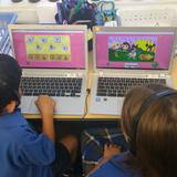 St. George Parish School Photo #3 - Primary Grade Students Engaged with ChromeBooks in the classroom
