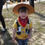 Flaming Sword Campus Photo - One of our kindergarten students poses for the camera in his Woody Toy Story Outfit. "There's a snake in my boot !!!"