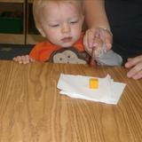 Monroe KinderCare Photo #7 - Exploring foods!! Our toddlers work on their eye hand coordination, cause and effect and fine motor skills as they learn how to cut a variety of different foods.