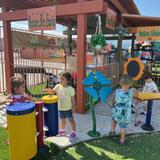 Kids Adventure Learning Center Photo #4 - Joyful sounds fill the air in our outdoor music garden! Making music helps our preschoolers develop language, listening, coordination, and self-expression. Our outdoor classrooms-including centers for music, art, and science-provide rich, hands-on learning experiences that spark creativity and support the whole child