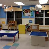 Orchards KinderCare Photo #6 - We have a large sensory table so multiple children can explore various sensory elements like sand, water, colored rice, natural materials and other items that fit the monthly theme.