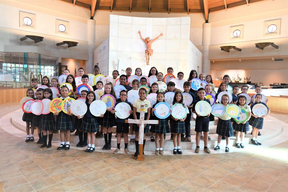 St. Mark Catholic School Photo #1 - Spreading the word of God through our 3rd graders during their Living Rosary prayer presentation.