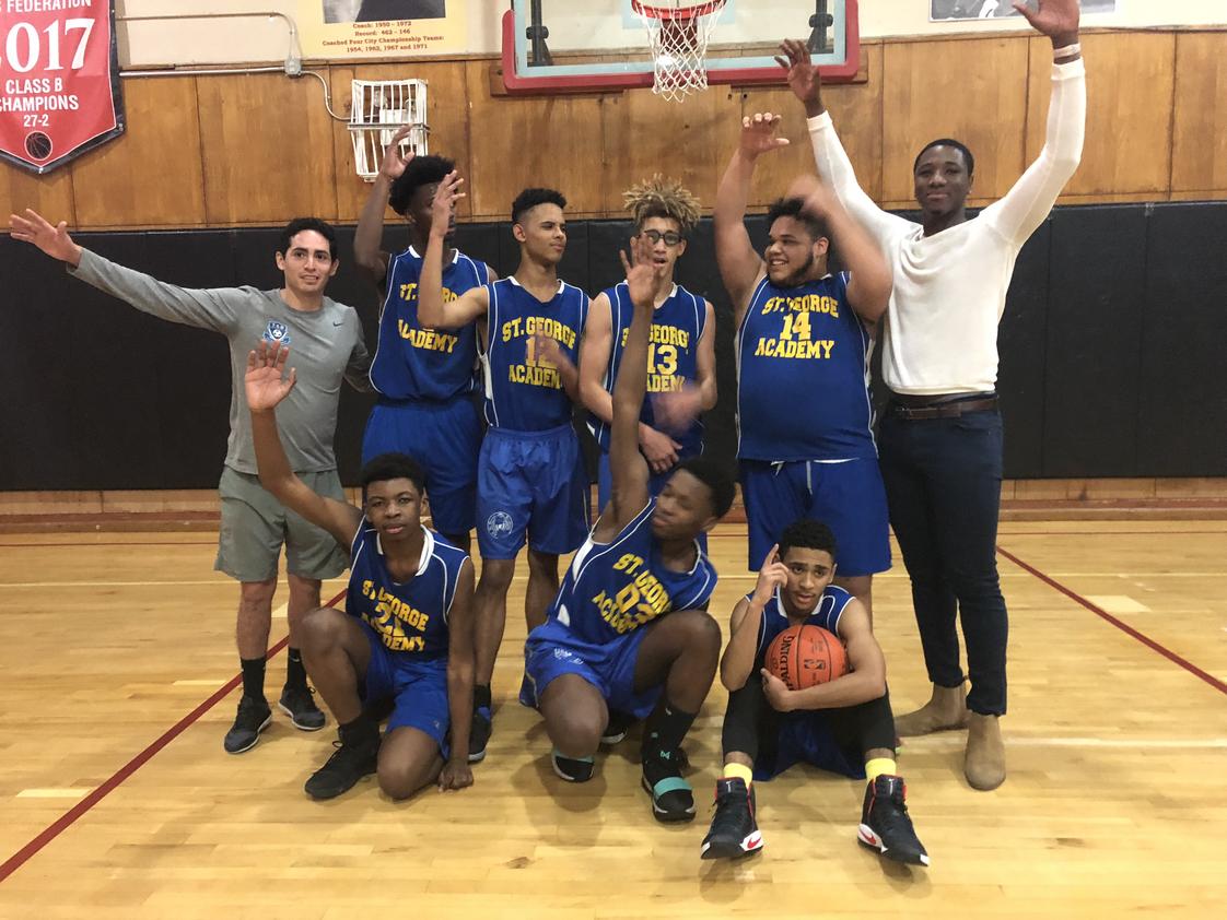 St. George Academy Photo #1 - Boys basketball team celebrate their victory. Not shown are the girls volleyball and basketball teams.