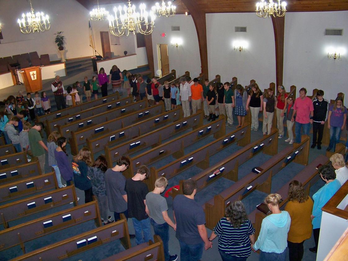 United Christian Academy Photo - Prayer in the sanctuary.