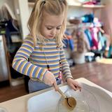 Quest Montessori School Photo #6 - In our Primary program, practical life work like washing dishes after snack teaches responsibility, care for the environment, and independence. It builds coordination and focus while helping children see themselves as capable members of their community.