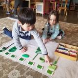 Jonathan Montessori School Photo #3 - Sorting with the color tiles.