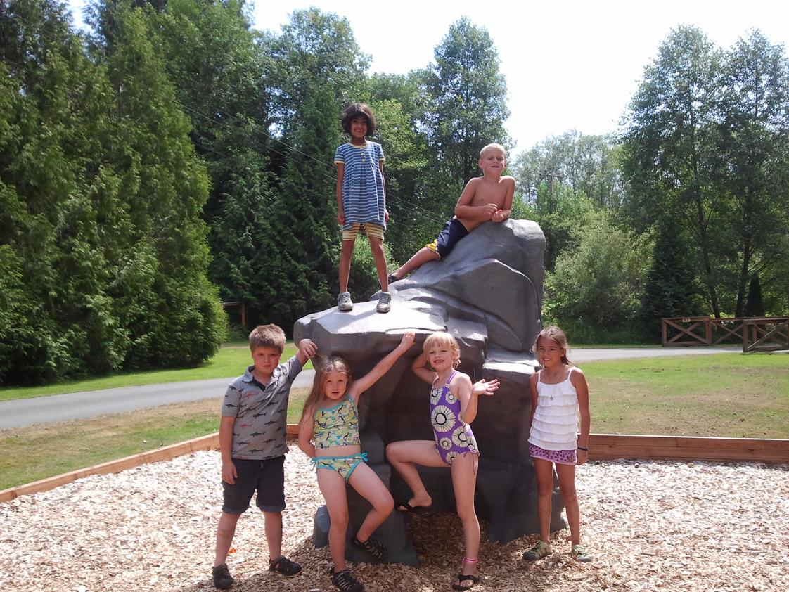 Montessori Children's House Photo #1 - Our Elementary students on our climbing boulder.