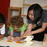 Leport Montessori Irvine Westpark Photo #6 - Montessori guide giving math lesson in preschool