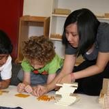 Leport School Irvine West Park Photo #6 - Montessori guide giving math lesson in preschool