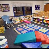 Hazel Dell KinderCare North Photo #7 - Welcome to our infant room where we spend most of our time playing on the floor with our babies.