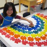 Benedetti Drive KinderCare Photo #10 - Painting a rainbow in PreK