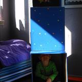 Woodridge South KinderCare Photo #9 - Ryan enjoyed using the rocket ship to pretend to explore space during the "up in the sky" unit.