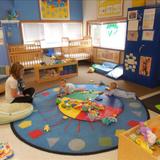 New Lenox KinderCare Photo - Hanging out with Miss Sarah for Tummy Time!