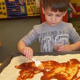 Rockland KinderCare Photo #4 - Cooking pizza in Preschool