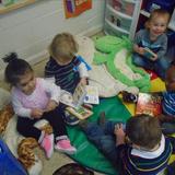 Telegraph Road KinderCare Photo #2 - Children reading in the Toddler classroom.