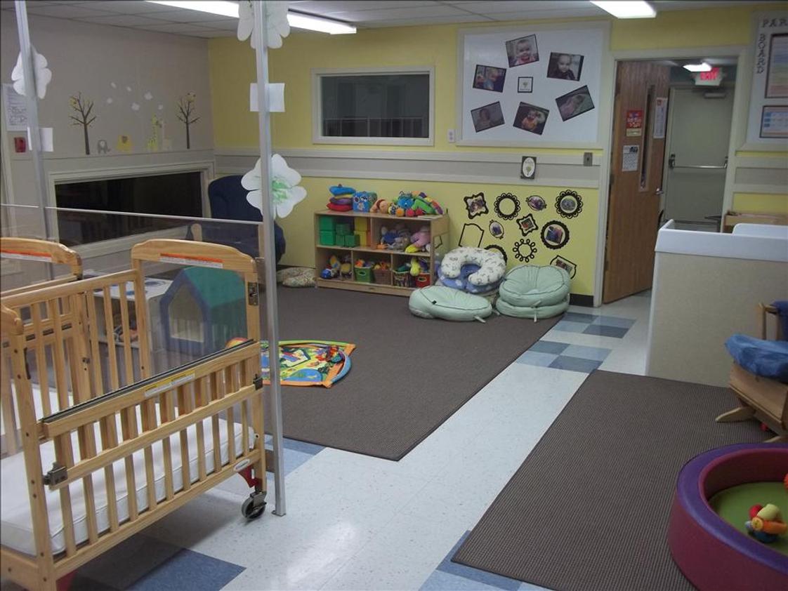 Silver Spring KinderCare Photo #1 - The infant classroom has a great large space for exploring and low windows that the children can look out of.