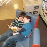 Prairie View KinderCare Photo #7 - Helping our friends practice reading in the School-Age Classroom.