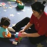 Washington Township KinderCare Photo #6 - Ms. Donna works with the infants on counting and stacking blocks.