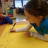 Prattville KinderCare Photo #10 - This is What Learning Looks Like: Building brain power using venn diagrams to classify data by similar and non-similar attributes.
