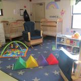 Cascade Park KinderCare Photo #3 - We work with infants in a least restrictive environment, spending most of the time on the floor helping them learn and grow at their own pace.