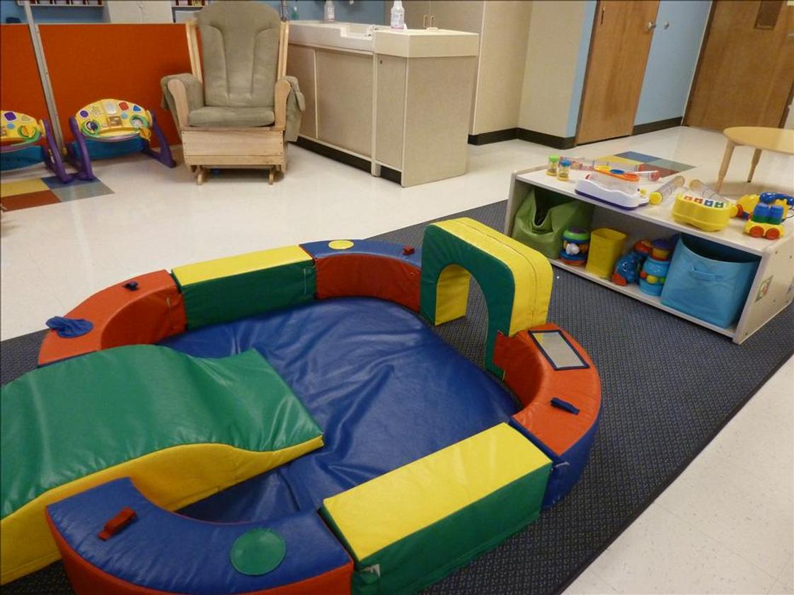 Florence KinderCare Photo #1 - Our infant classroom is all theirs to explore. We provide a least restrictive atmosphere which allows the infants to roam and explore their space.