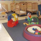 North Mustang Road KinderCare Photo #3 - Our infant classroom provides opportunities for gross motor skill development in a safe, loving environment. There are many different textures and combinations of object to promote learning through the senses as well as fine motor skill developement.