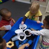 Fordson Road KinderCare Photo - Toddler Science - having fun exploring dirt at the sensory table.