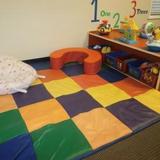 KinderCare at Hunt Club Photo #4 - This area allows for plenty of room for tummy time on a soft colorful surface
