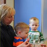 Meadowlands KinderCare Photo #9 - The Discovery Preschool room enjoys a little group time with Ms. Bev