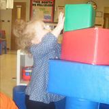 Center Street KinderCare Photo #3 - Children under 2 years of age learn through exploration. Look at how high this toddler can build!