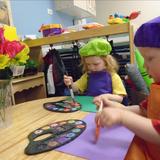 Elmhurst KinderCare Photo #1 - We provide independent two-year-olds opportunities to express themselves through art, movement, drama, and music.