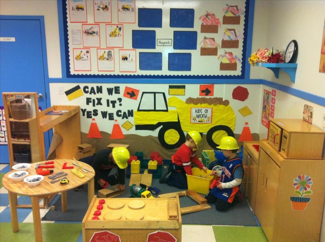 Shelton KinderCare Photo #1 - This is one of the enhancements for our dramatic play area. The children helped the teacher create a construction site during the tools and machines unit. The children used blocks, hammers, screw drivers, levels and so many more tools as they build different buildings, factories and structures. The children were arctitects, construction workers and used their imagination to be whatever they wanted to be! They used their hand-eye coordination, role paying skills, cooperation and problem-solving skills and gained knowledge of concepts such as area, height, weight and length while exploring cause and effect. Exploration is a leading form of learning here at KinderCare. Every activity, enhancement and toy has an educational purpose behind it. We would love to show you what your child will learn here!
