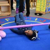 Windward Child Development Center Photo #8 - Students enjoy a little exercise by doing the Limbo!