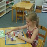 Lone Oak Montessori School Photo #3 - Collage helps develop creativity and fine motor skills, as well as practical life clean-up skills.