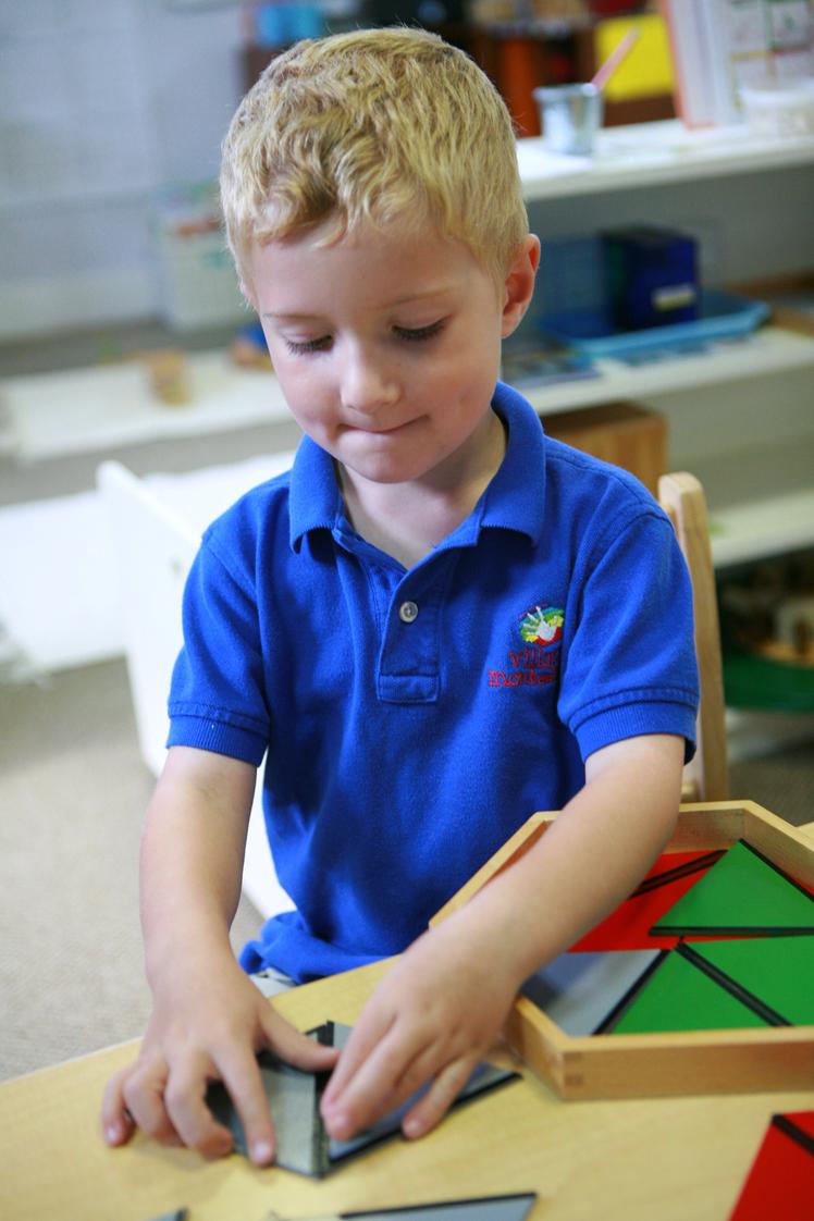 Village Montessori School Photo - Constructive Triangles are a preparation for Geometry at the preschool level.