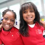 The IDEAL School of Manhattan Photo #8 - Two fourth graders in their uniform shirts