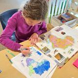 Christian Montessori Academy Photo #6 - Upper Elementary student working on labeling regions in Africa as a map work in our cultural studies.
