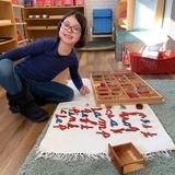 OKC Heartland Montessori School Photo #2 - Working with the movable alphabet.