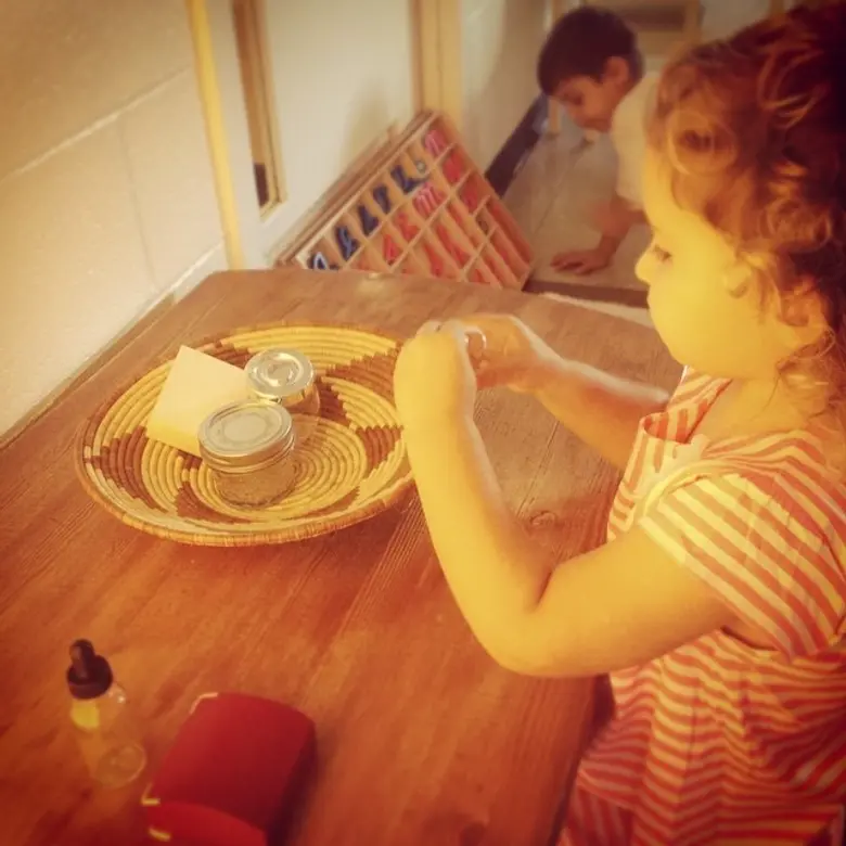 Full Circle Montessori School Photo #2 - In the Preliminary Exercises, the child learns the basic movements of all societies such as pouring, folding, carrying, and opening and closing containers.