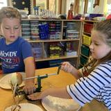 Tate's School Photo #11 - Kindergarten students apply hand-eye coordination as they prepare to taste apples grown on campus