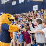 Second Baptist School Photo #11 - Lower school student high five Eli the Eagle at an all school pep rally.