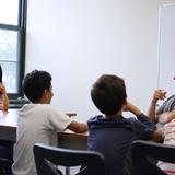 Primoris Academy Photo #4 - Elementary school students studying the impact of human dwellings on animal habitats have the chance to ask some of their questions to a bear expert.