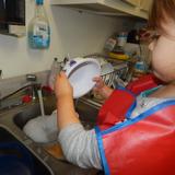 Live Oak Montessori School Photo #6 - Washing dishes after snack is a regular practice in our 3-6 year old classroom