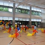 BASIS Independent McLean Photo #3 - Primary students rehearse a traditional Chinese dance in the gymnasium.