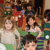 BASIS Independent McLean Photo #7 - PreK students parade in vehicles they built from boxes as part of a transportation themed project.