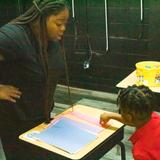 Destiny Calling Academy Photo #10 - Our Assistant Principal Ms. E is working with our 1st- grade class.