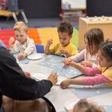 Academy On The Hills Photo #6 - Working with our students on a painting project.
